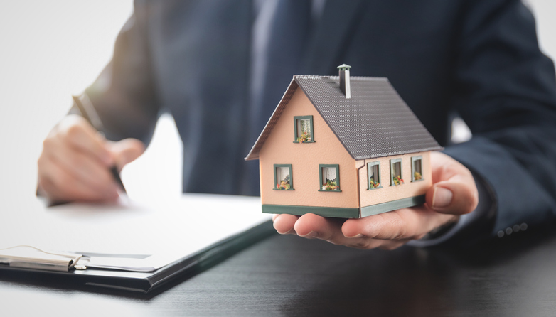Property Management Professional with House Model